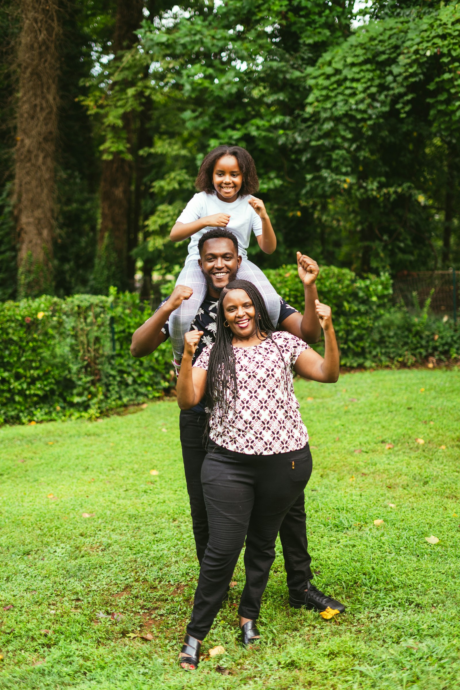 A family laughing and celebrating together outdoors