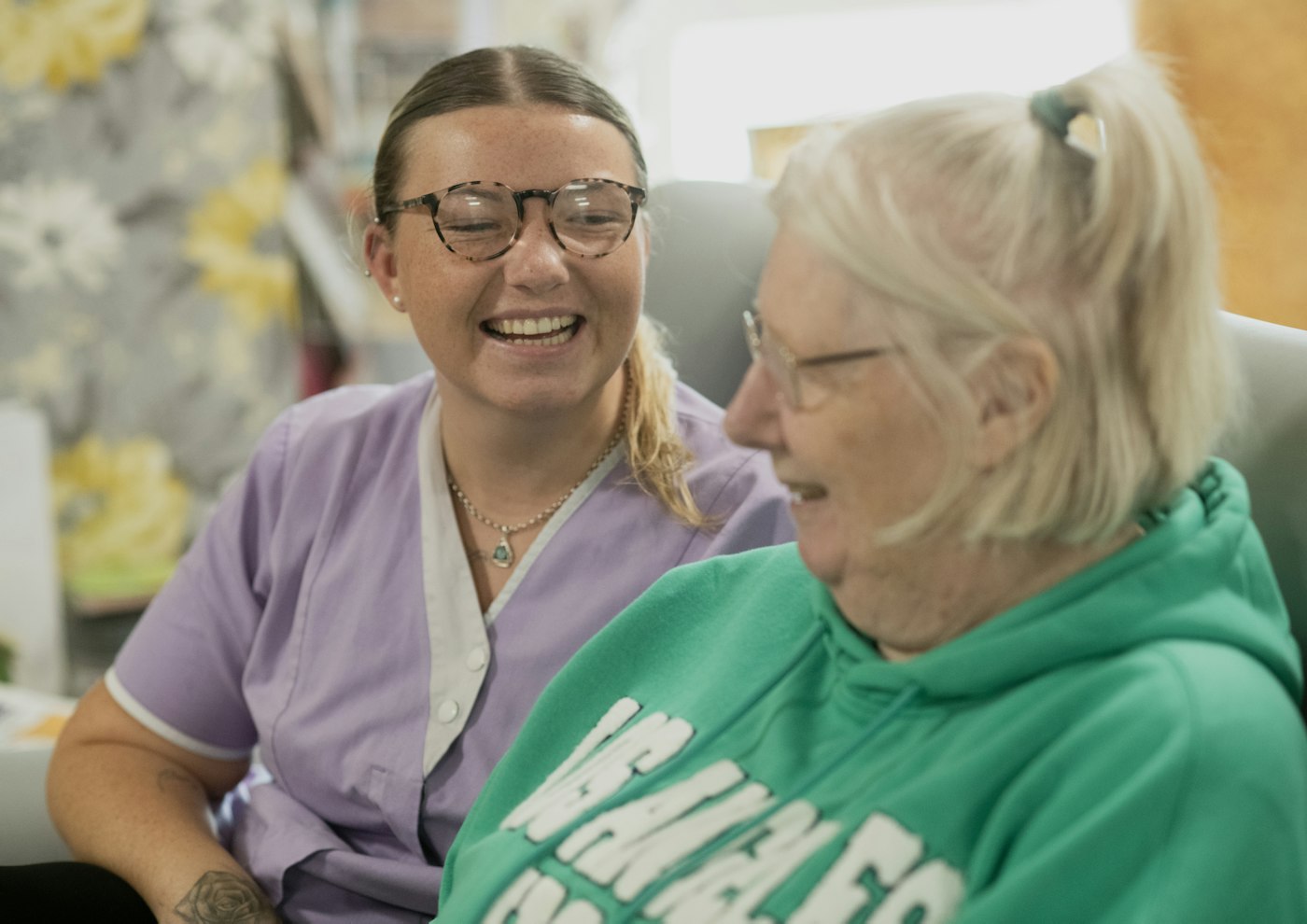 Two women laughing together